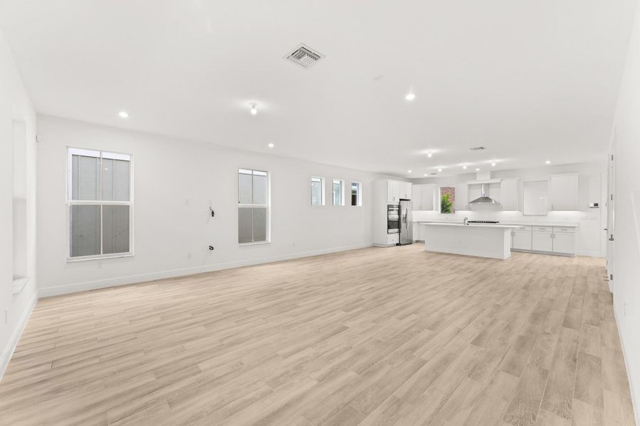 Front exterior of a new home in Newfield - Rosette Park, Palm City, FL, highlighting curb appeal (Image 1). Front exterior of a new home in Newfield - Rosette Park, Palm City, FL, highlighting curb appeal (Image 1).