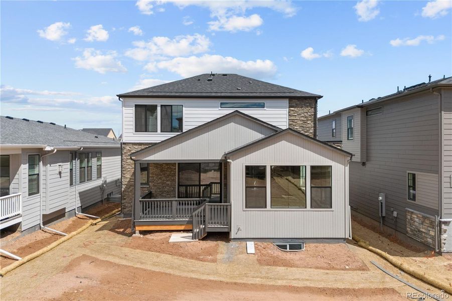Front exterior of a new home in Harmony at Sterling Ranch, Littleton, CO, highlighting curb appeal (Image 1). Front exterior of a new home in Harmony at Sterling Ranch, Littleton, CO, highlighting curb appeal (Image 1).