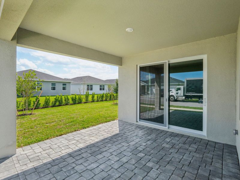 Exterior details and patio area of a home in Brystol at Wylder - Reserve Series, Port St. Lucie (Image 3).