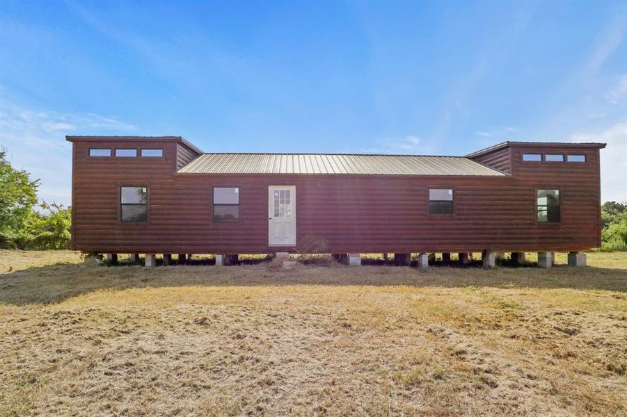 Front exterior of a new home in , Grand Saline, TX, highlighting curb appeal (Image 10).