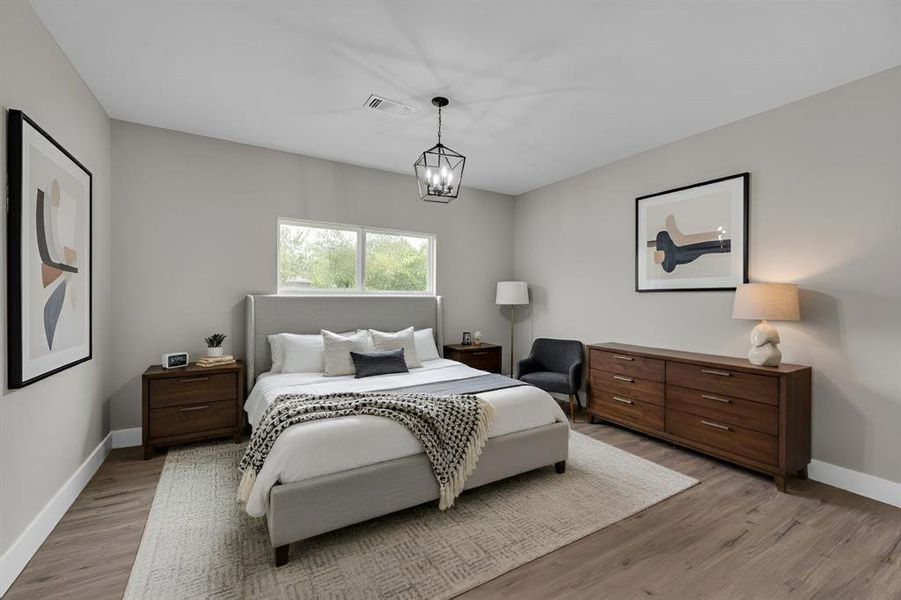 Bedroom with baseboards and light wood-type flooring