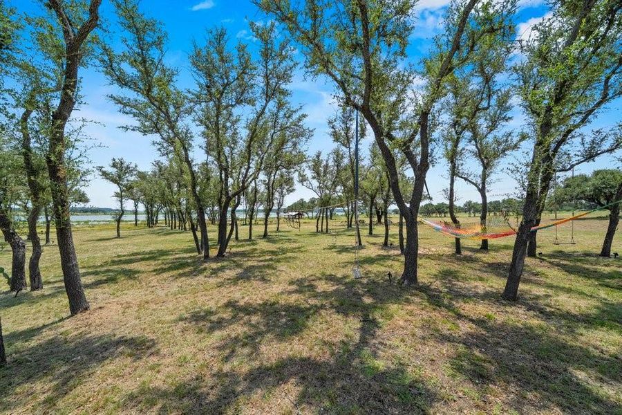 A canopy of mature oak trees provides welcome shade and exceptional privacy while preserving the property's peaceful Hill Country character and park-like setting. A canopy of mature oak trees provides welcome shade and exceptional privacy while preserving the property's peaceful Hill Country character and park-like setting.