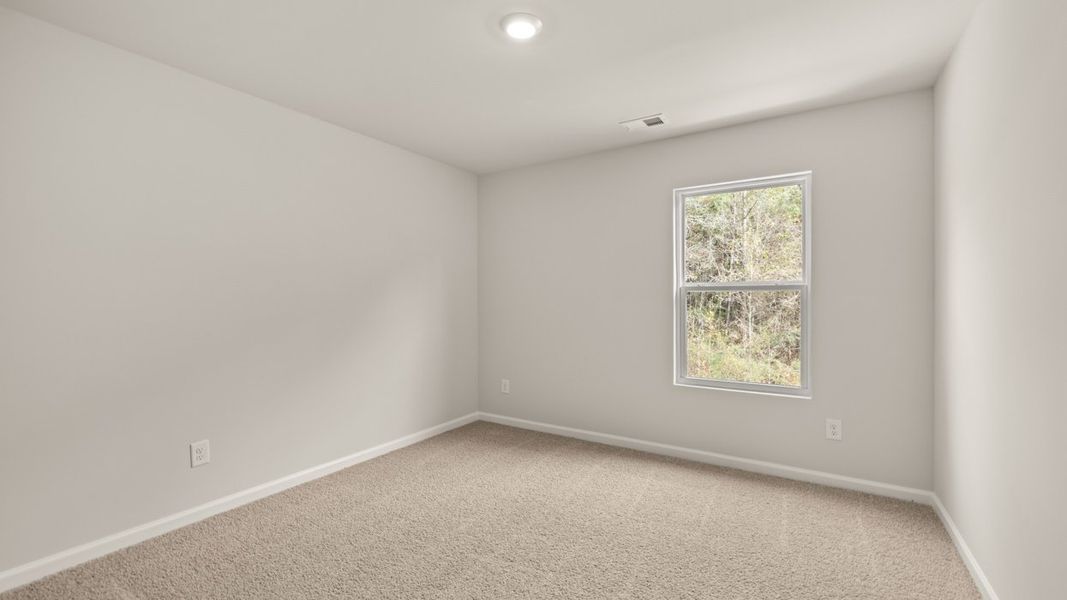 Spacious, unfurnished interior of a new home in The Reserve at Calcutta, Stockbridge (Image 24).