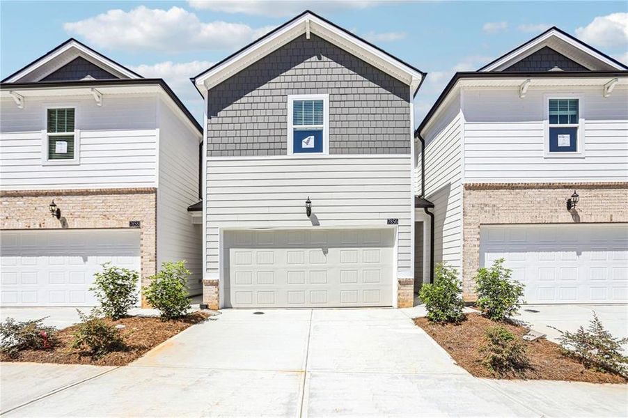 Front exterior of a new home in Artisan Walk, Fairburn, GA, highlighting curb appeal (Image 19).