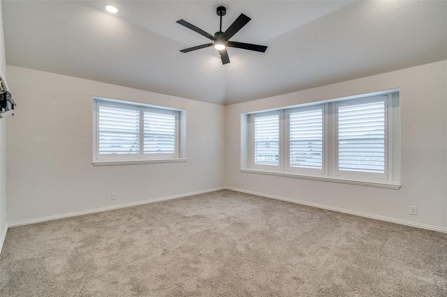 Upstairs game, living or office area! Carpeted with ceiling fan and lofted ceiling