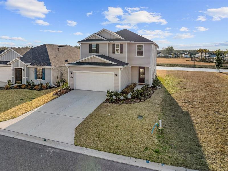 Front exterior of a new home in Somerset - Classic Series, Palm Coast, FL, highlighting curb appeal (Image 25).