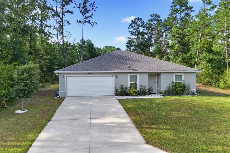 Front exterior of a new home in Ocala, Ocala, FL, highlighting curb appeal (Image 21). Front exterior of a new home in Ocala, Ocala, FL, highlighting curb appeal (Image 21).