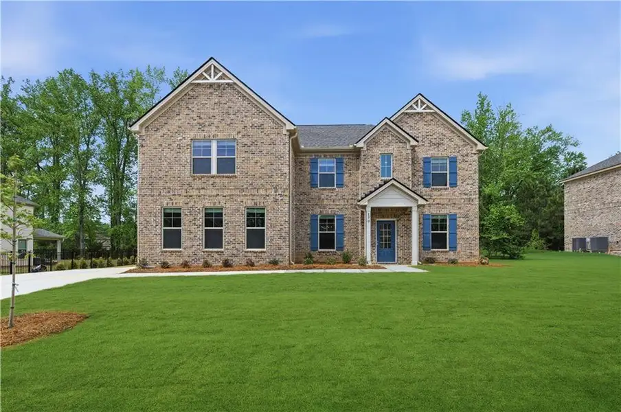 Front exterior of a new home in Cambria at Traditions, Hampton, GA, highlighting curb appeal (Image 17).