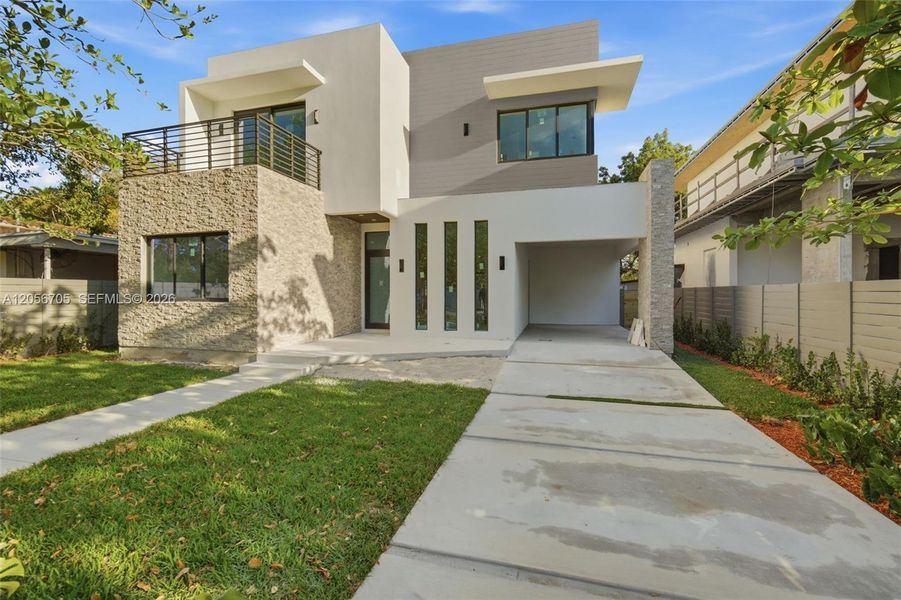 Front exterior of a new home in , Miami, FL, highlighting curb appeal (Image 1). Front exterior of a new home in , Miami, FL, highlighting curb appeal (Image 1).
