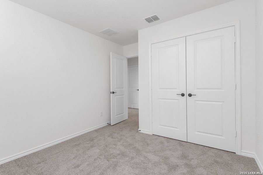 Spacious, unfurnished interior of a new home in Preserve at Culebra - Heritage Collection, San Antonio (Image 16).