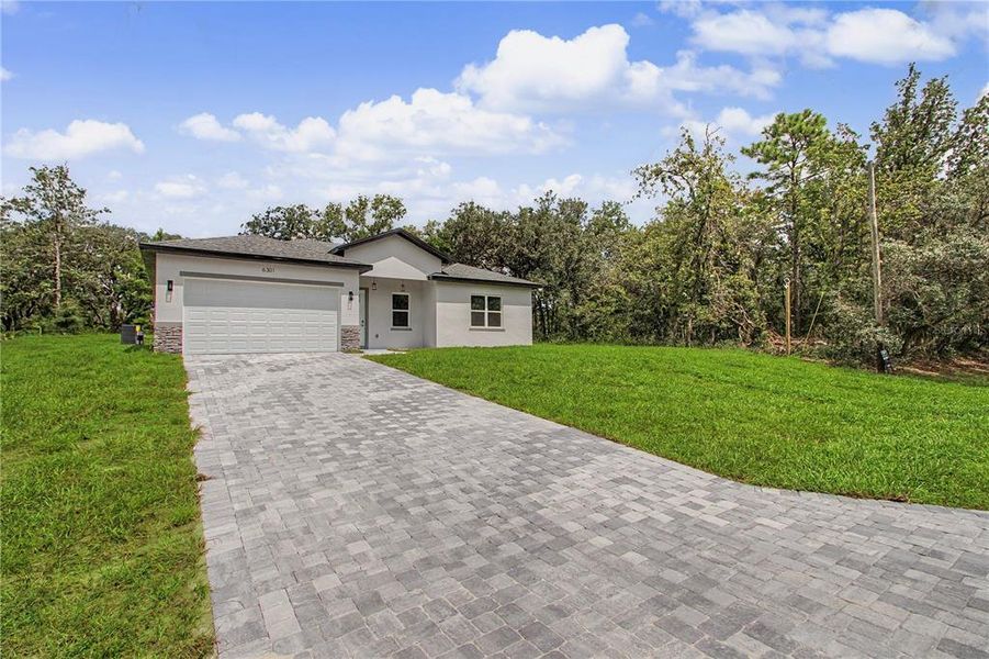 Front exterior of a new home in , Ocala, FL, highlighting curb appeal (Image 23).