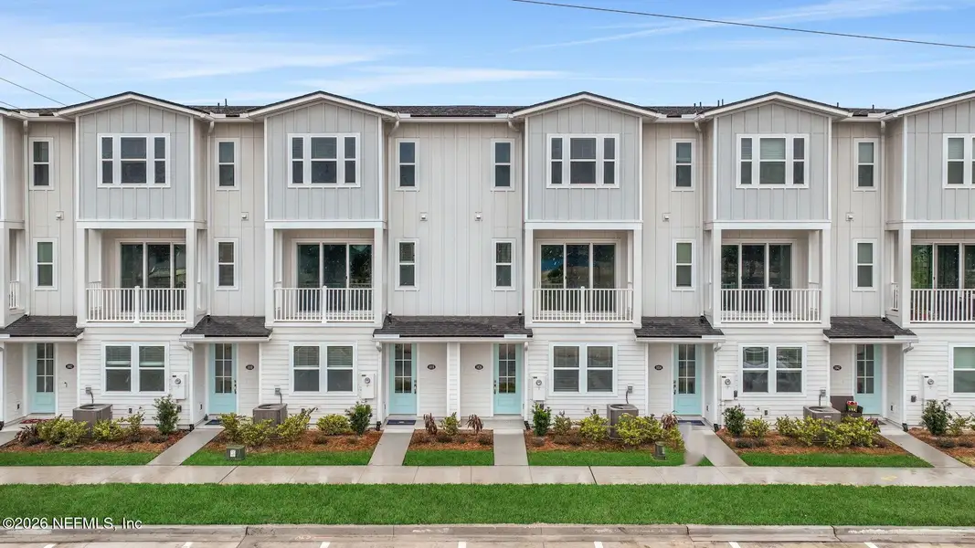 Front exterior of a new home in , Jacksonville Beach, FL, highlighting curb appeal (Image 21).