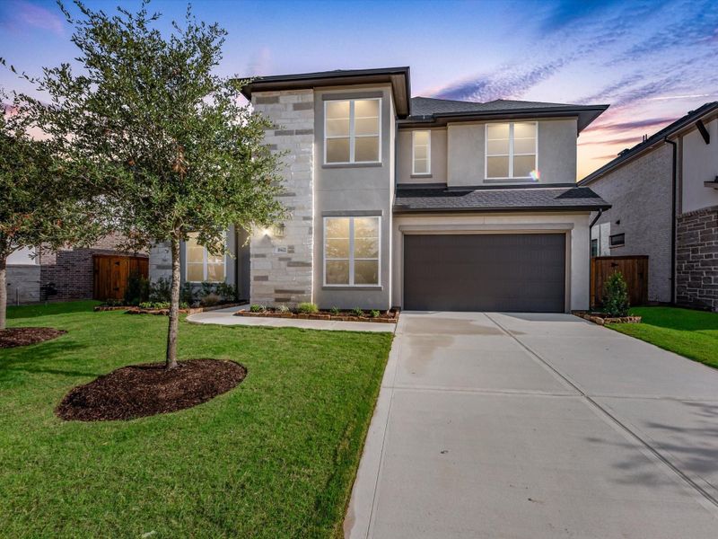 Front exterior of a new home in Trillium, Richmond, TX, highlighting curb appeal (Image 1). Front exterior of a new home in Trillium, Richmond, TX, highlighting curb appeal (Image 1).