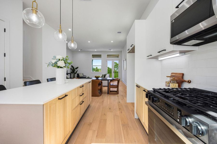 Another view of the large kitchen, equipped with Samsung stainless steel appliances.