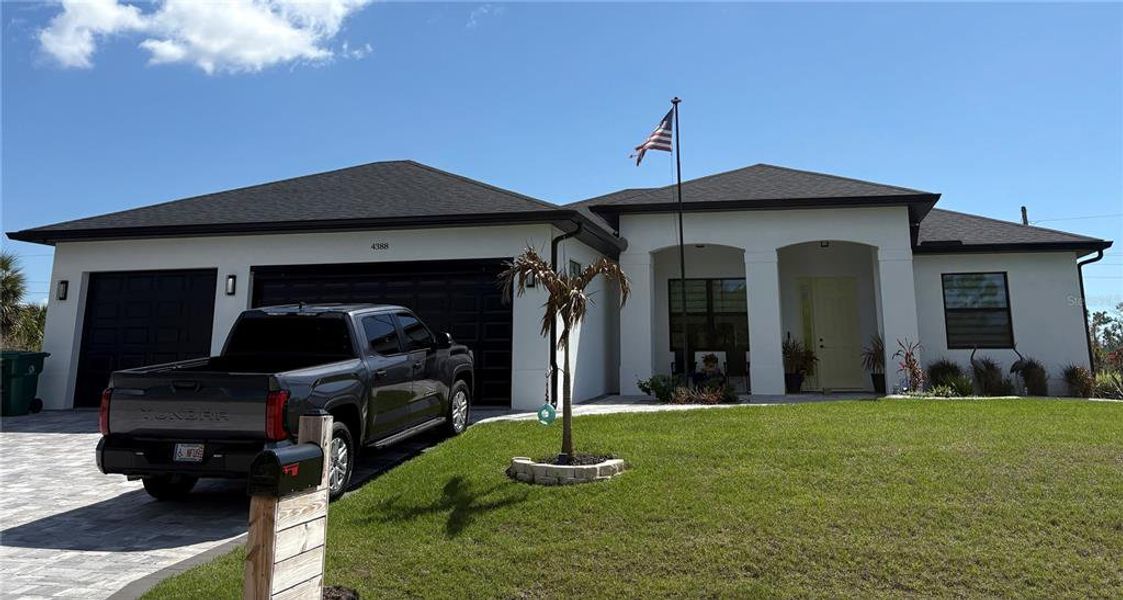 Front exterior of a new home in , Port Charlotte, FL, highlighting curb appeal (Image 19).