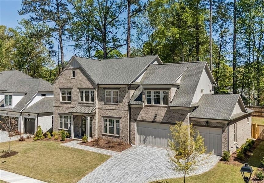 Front exterior of a new home in The Enclave on Lavista, Tucker, GA, highlighting curb appeal (Image 24). Front exterior of a new home in The Enclave on Lavista, Tucker, GA, highlighting curb appeal (Image 24).