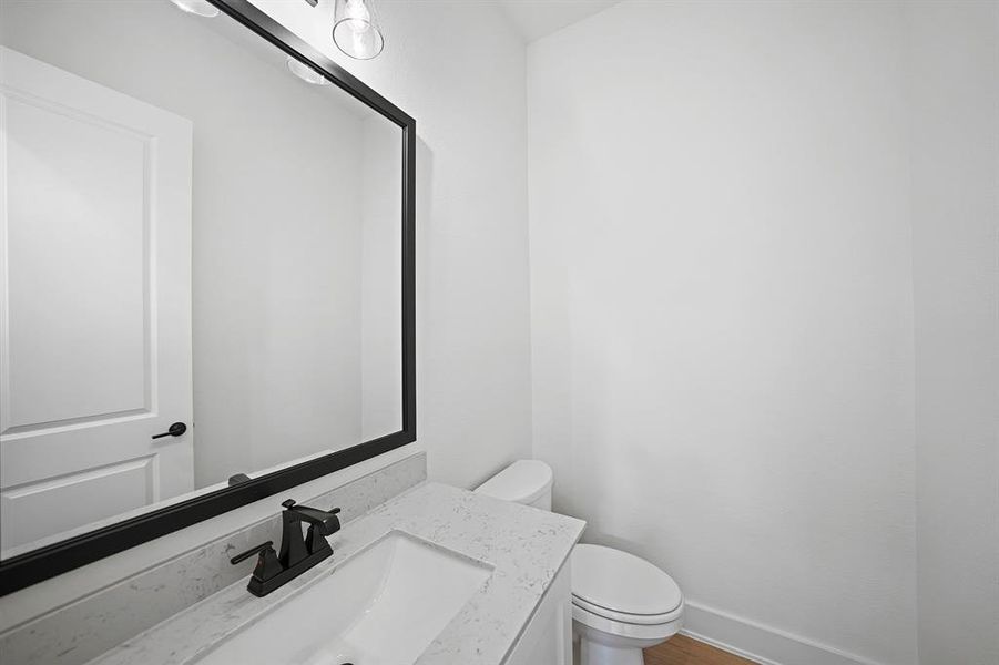 Bathroom featuring vanity and wood finished floors