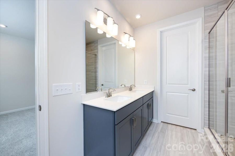 Walk-In Closet Located in the Primary Bathroom Walk-In Closet Located in the Primary Bathroom