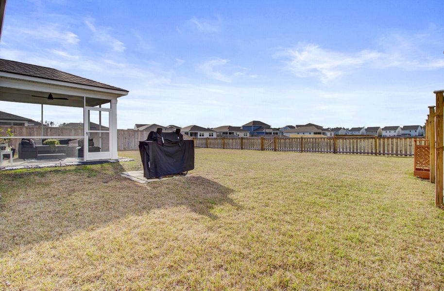 Exterior details and patio area of a home in Sanctuary Cove at Cane Bay, Summerville (Image 24).