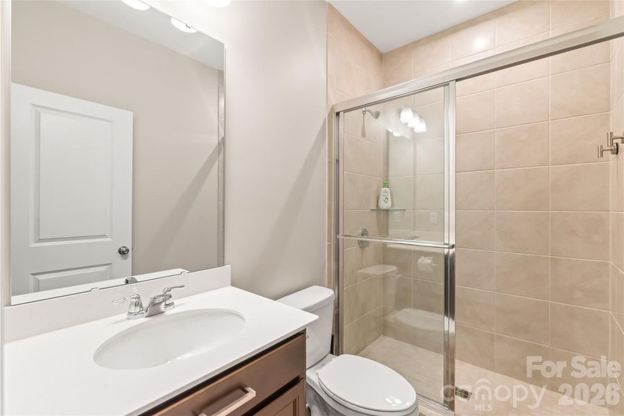 Full bath for tucked-away main-level guest suite
