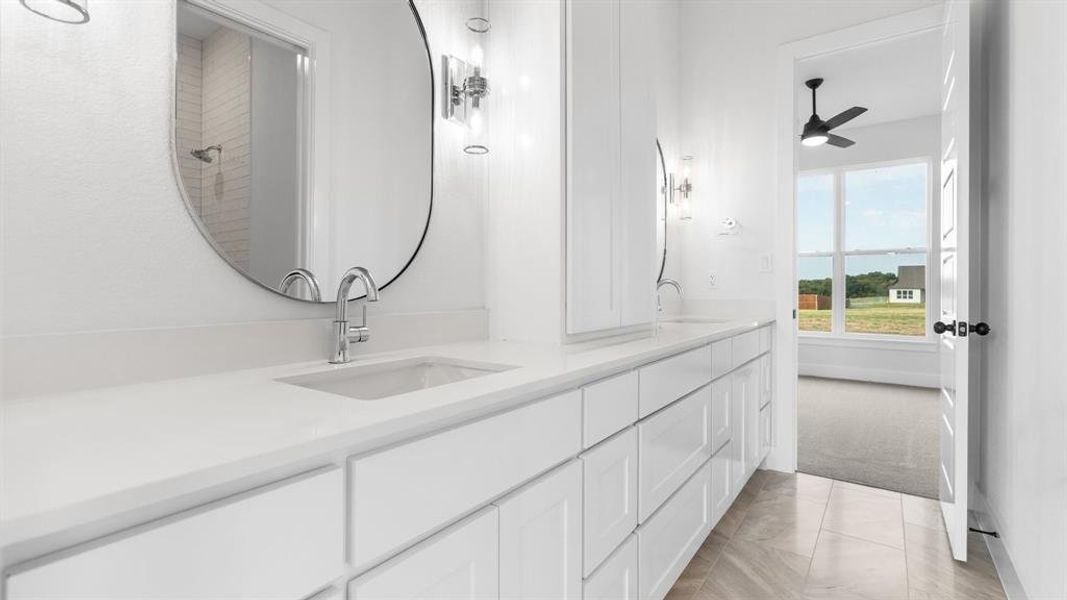 Bathroom featuring vanity and ceiling fan