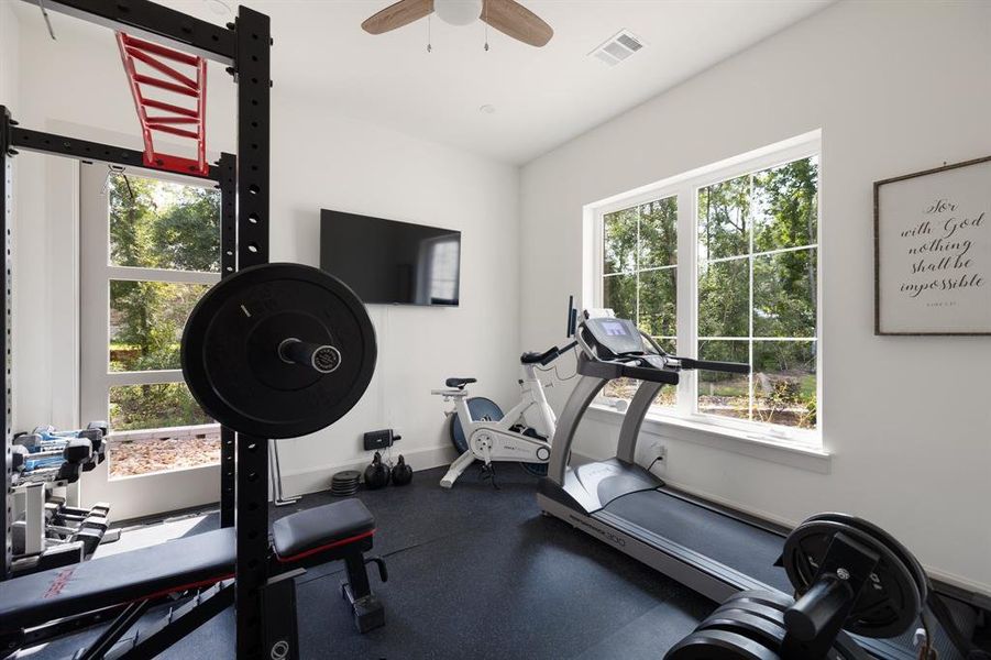 Hidden room through the primary closet with views of the wooded lot.