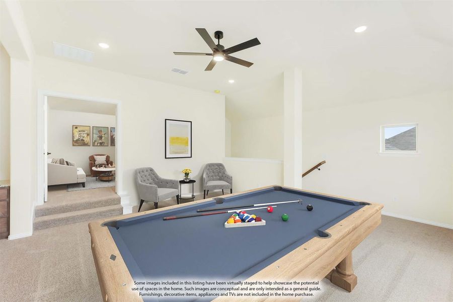 Upstairs game room with pool table, ceiling fan, and seating area adjacent to open loft space Upstairs game room with pool table, ceiling fan, and seating area adjacent to open loft space