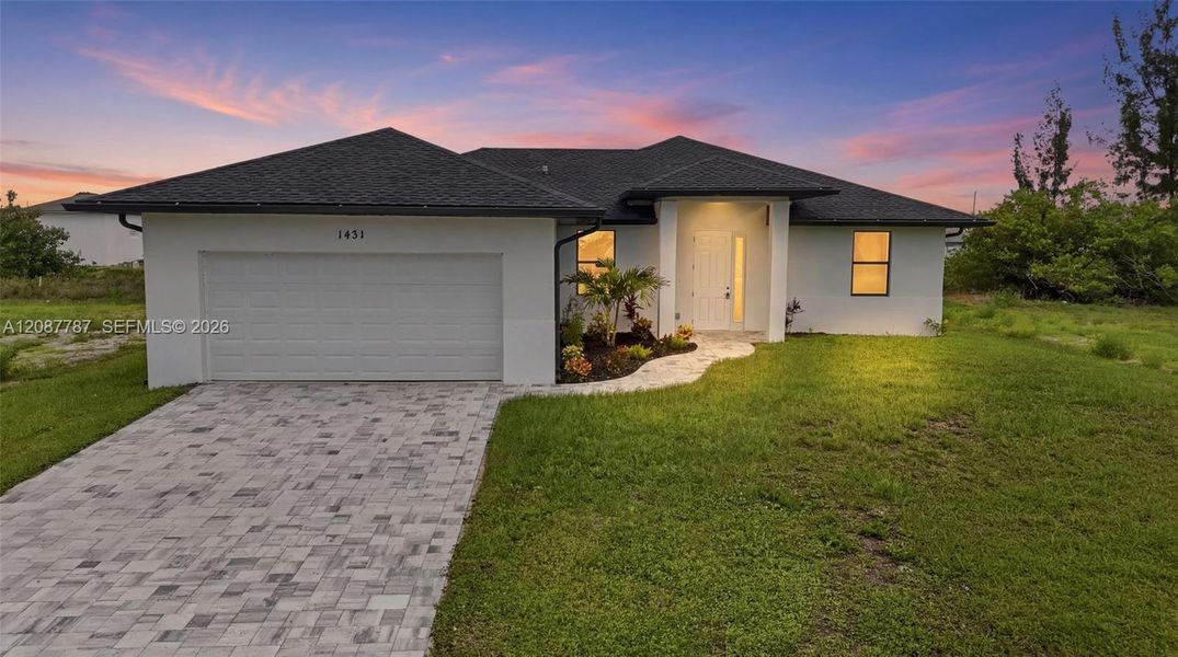 Front exterior of a new home in , Cape Coral, FL, highlighting curb appeal (Image 20). Front exterior of a new home in , Cape Coral, FL, highlighting curb appeal (Image 20).