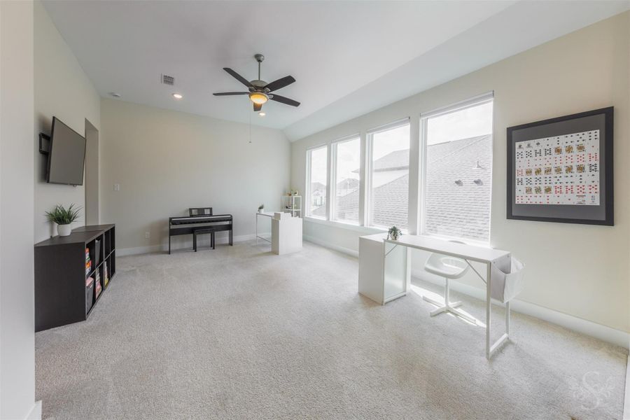 Impressive upstairs game room is enhanced by a dramatic vaulted ceiling and an expansive wall of windows. This light-filled retreat offers an exceptional amount of space for games, hobbies and memorable family fun. Impressive upstairs game room is enhanced by a dramatic vaulted ceiling and an expansive wall of windows. This light-filled retreat offers an exceptional amount of space for games, hobbies and memorable family fun.