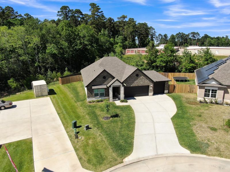 Front exterior of a new home in Lexington Heights, Willis, TX, highlighting curb appeal (Image 24).