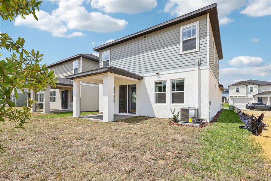 Exterior details and patio area of a home in Cyrene at Minneola, Minneola (Image 23).