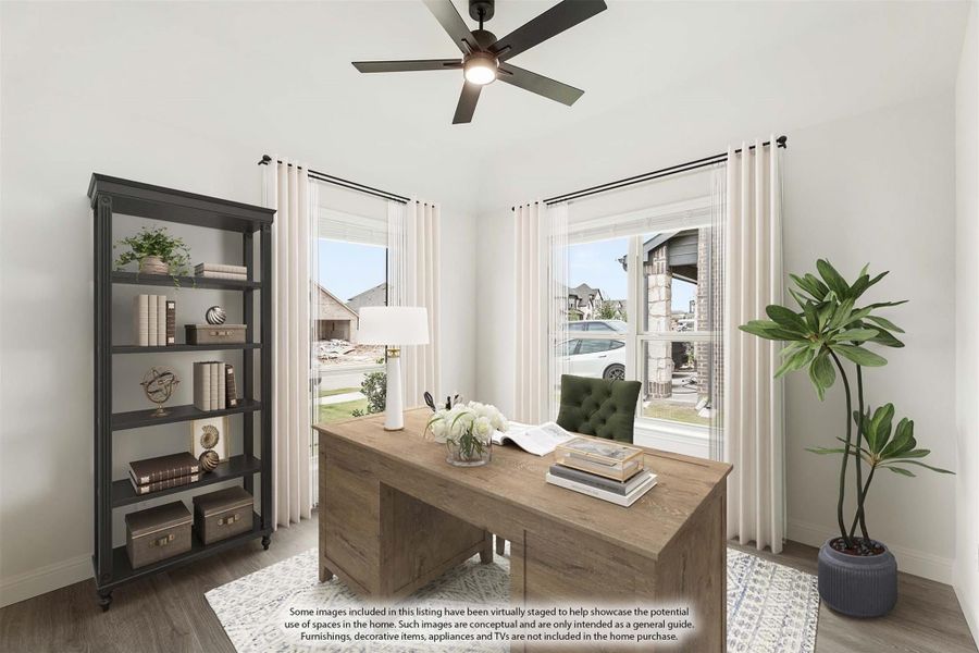 Home office with wood desk, ceiling fan, bookshelf, and two windows with white curtains Home office with wood desk, ceiling fan, bookshelf, and two windows with white curtains