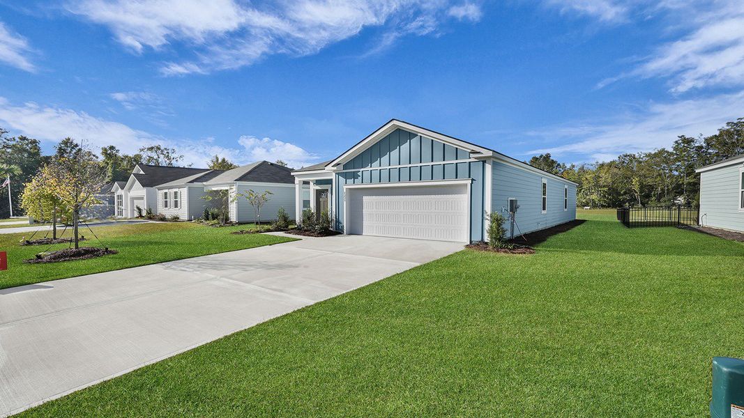 Front exterior of a new home in The Oaks at Center Station, Hollywood, SC, highlighting curb appeal (Image 2). Front exterior of a new home in The Oaks at Center Station, Hollywood, SC, highlighting curb appeal (Image 2).
