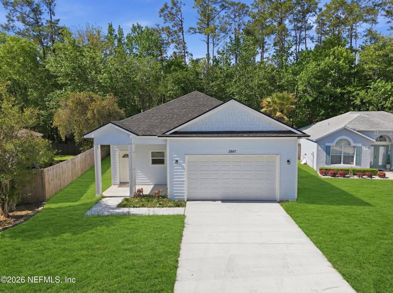 Front exterior of a new home in , Middleburg, FL, highlighting curb appeal (Image 2). Front exterior of a new home in , Middleburg, FL, highlighting curb appeal (Image 2).