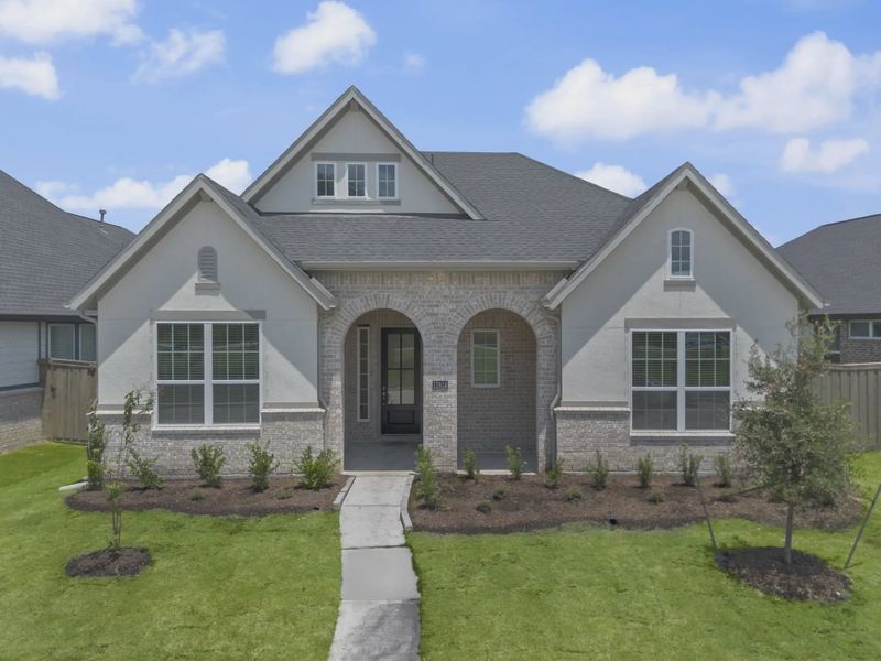 Representative exterior photo of a completed home built from the Mickelson by Chesmar Homes in Riceland Alley Loads, Mont Belvieu, TX (Image 36).