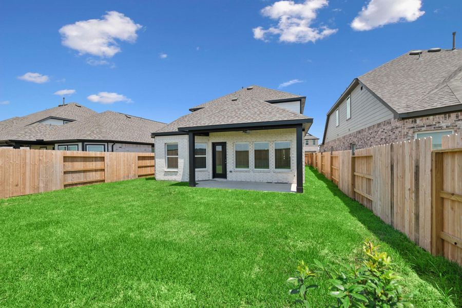 Front exterior of a new home in Marvida, Cypress, TX, highlighting curb appeal (Image 1).