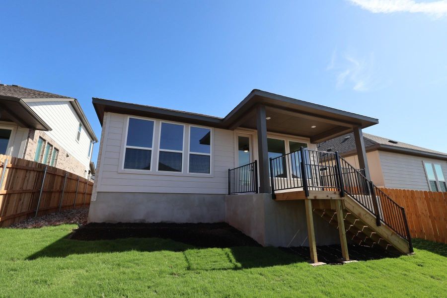Exterior details and patio area of a home in Heritage, Dripping Springs (Image 15).