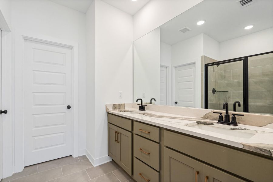 Dual vanity with integrated sinks and stone-finish countertop Dual vanity with integrated sinks and stone-finish countertop