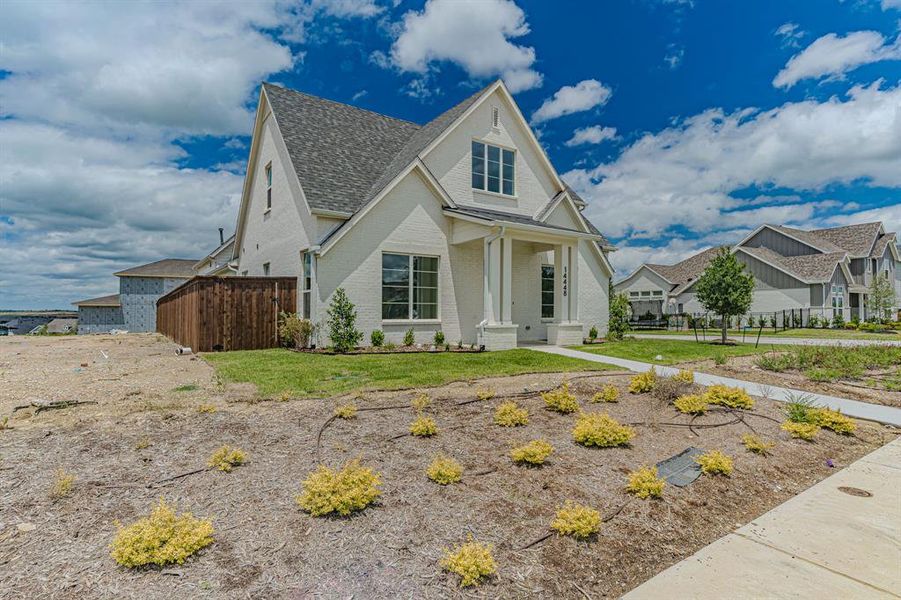 Front exterior of a new home in , Aledo, TX, highlighting curb appeal (Image 23).