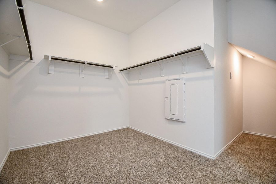 Expansive master closet offering ample storage and organization space.