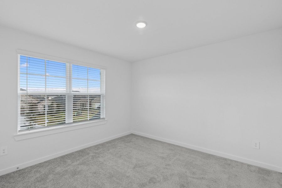 Spacious, unfurnished interior of a new home in Pinewood at Grand Texas, New Caney (Image 28).