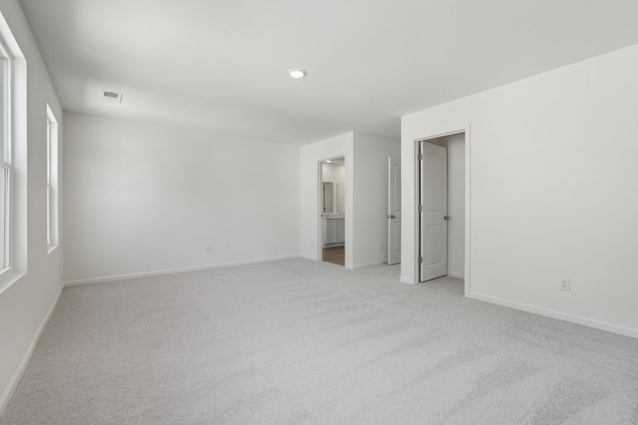 A long hallway with white walls.