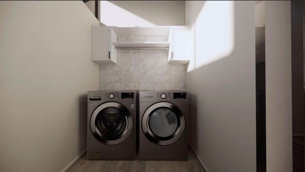 RENDERING - Laundry area with light wood-style floors, washing machine and dryer, and cabinet space