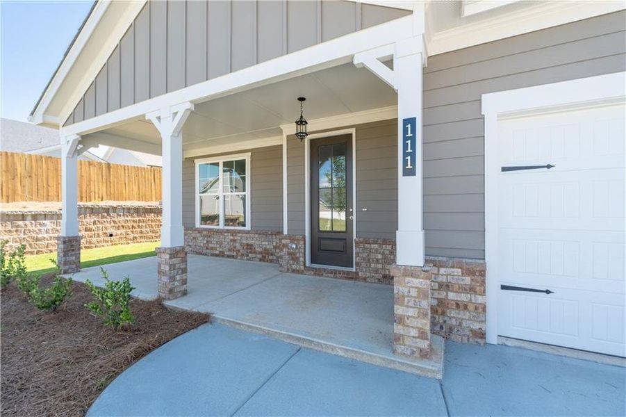 Front exterior of a new home in Waters Edge, Mansfield, GA, highlighting curb appeal (Image 1). Front exterior of a new home in Waters Edge, Mansfield, GA, highlighting curb appeal (Image 1).