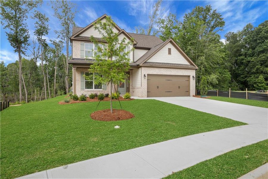 Front exterior of a new home in , Loganville, GA, highlighting curb appeal (Image 24). Front exterior of a new home in , Loganville, GA, highlighting curb appeal (Image 24).