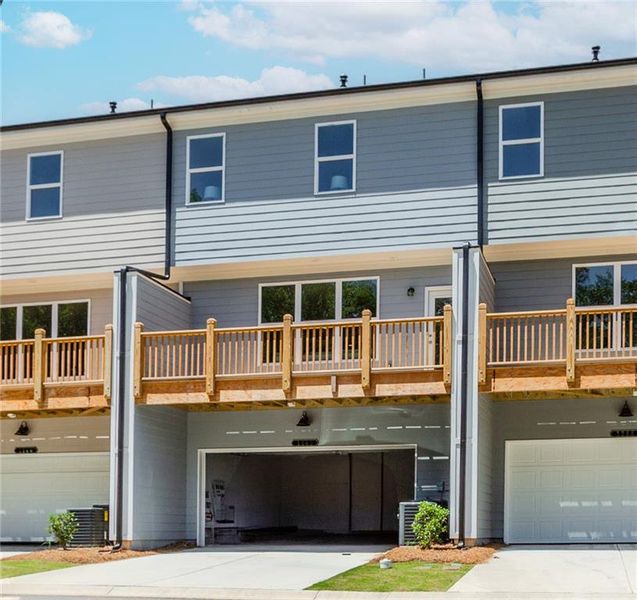 Front exterior of a new home in Hillcrest Landing, Sugar Hill, GA, highlighting curb appeal (Image 29). Front exterior of a new home in Hillcrest Landing, Sugar Hill, GA, highlighting curb appeal (Image 29).