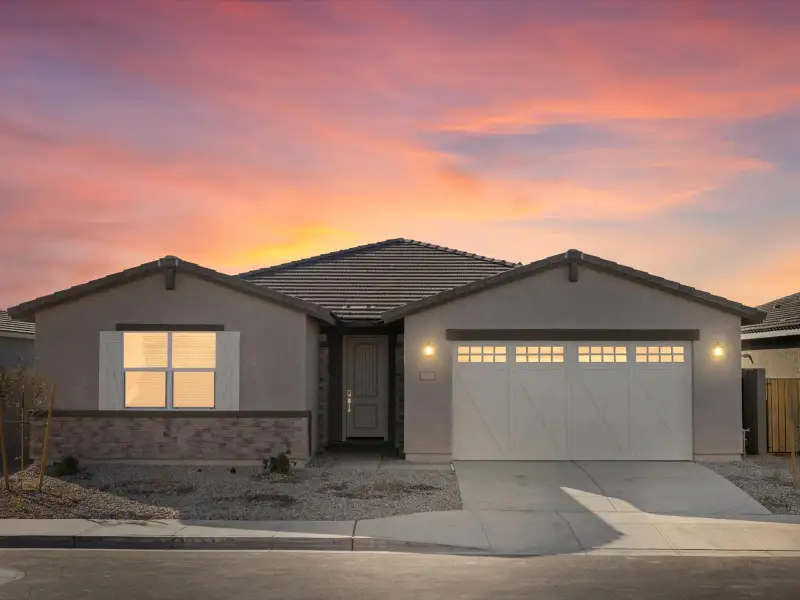 Front exterior of a new home in Rancho Mirage Signature Series, Maricopa, AZ, highlighting curb appeal (Image 1). Front exterior of a new home in Rancho Mirage Signature Series, Maricopa, AZ, highlighting curb appeal (Image 1).