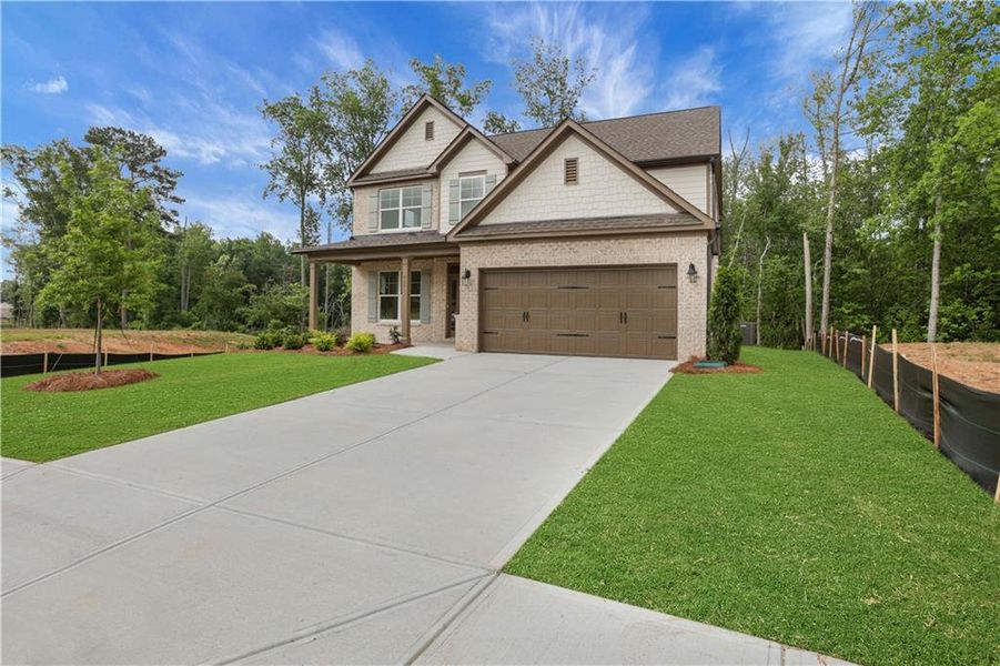 Front exterior of a new home in , Loganville, GA, highlighting curb appeal (Image 25). Front exterior of a new home in , Loganville, GA, highlighting curb appeal (Image 25).