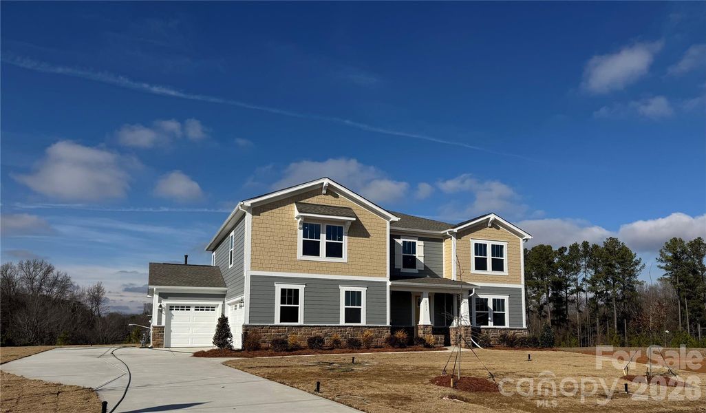 Front exterior of a new home in Blair Place, Monroe, NC, highlighting curb appeal (Image 2).