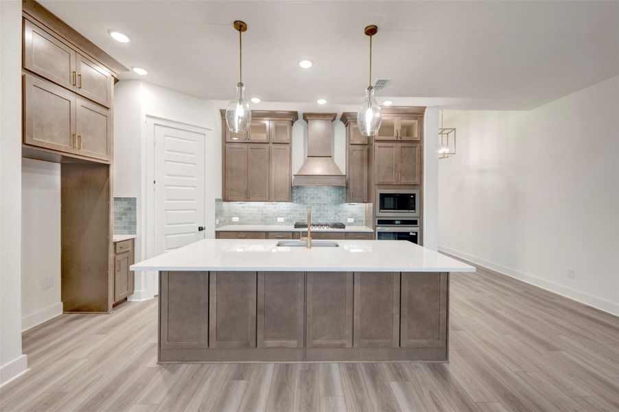 Furnished interior view inside a new home in Elyson 45', Katy (Image 7).